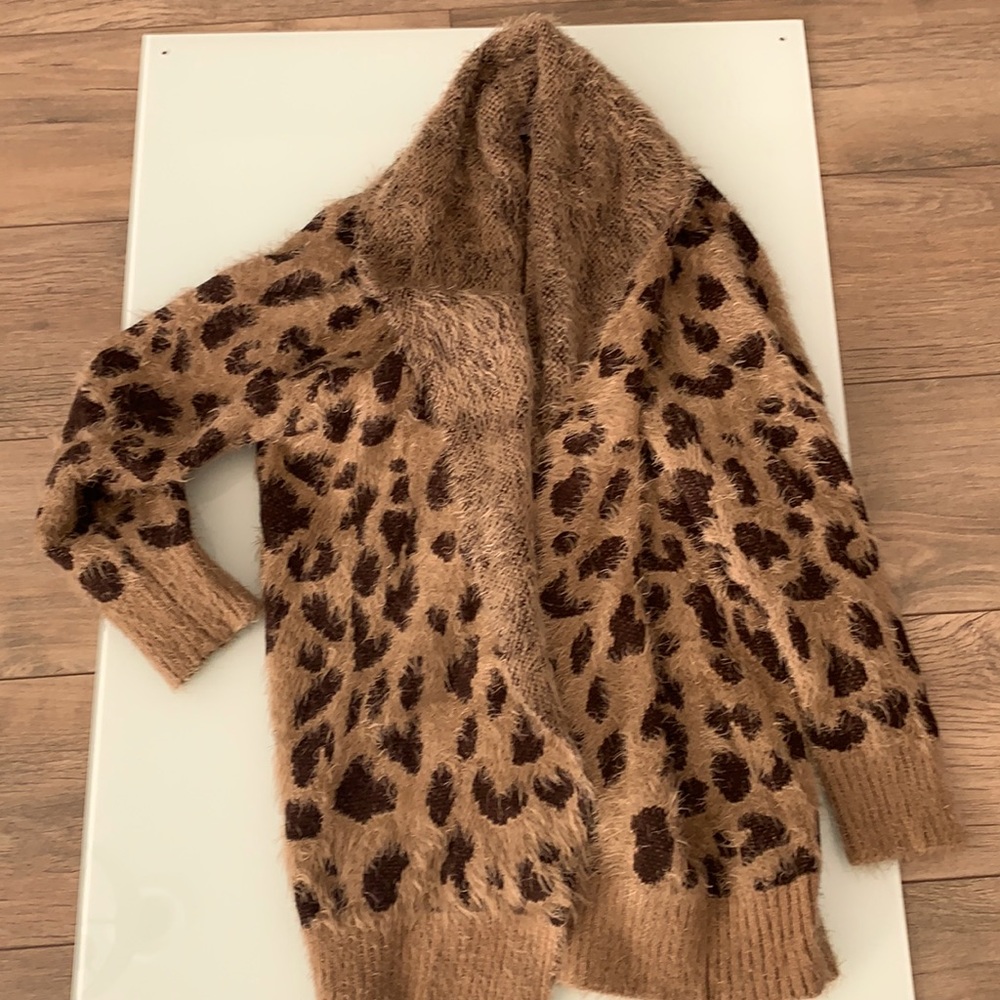 Animal print eyelash medium length sweater cardigan. Size M.